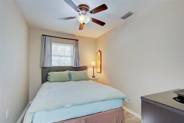 921 24th Ave N, Saint Petersburg, FL 33704 - bedroom with baseboards, light wood finished floors, and ceiling fan