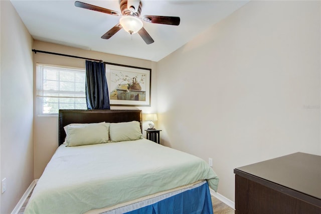 921 24th Ave N, Saint Petersburg, FL 33704 - bedroom with baseboards, a ceiling fan, and light wood-style flooring