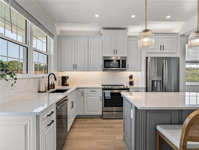 4215 Saltwater Pearl Way, Cortez, FL 34215 - kitchen featuring stainless steel appliances, light wood-style floors, backsplash, pendant lighting, and recessed lighting