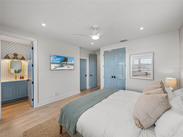 4215 Saltwater Pearl Way, Cortez, FL 34215 - bedroom with light wood-style flooring, a closet, ceiling fan, ensuite bathroom, and recessed lighting