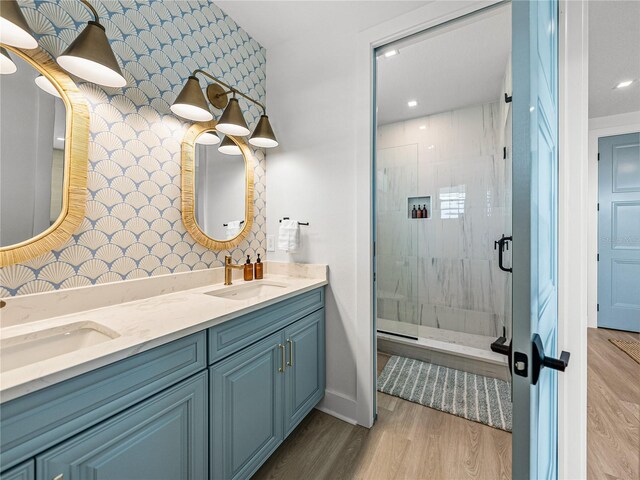 4215 Saltwater Pearl Way, Cortez, FL 34215 - bathroom with a stall shower, double vanity, wood finished floors, and recessed lighting