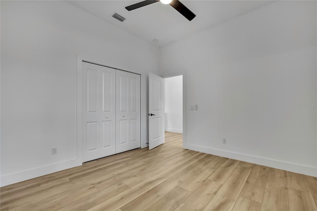 unfurnished bedroom featuring baseboards, visible vents, and light wood-style flooring