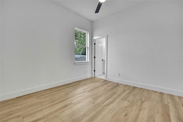 unfurnished room featuring baseboards, ceiling fan, and light wood-style floors