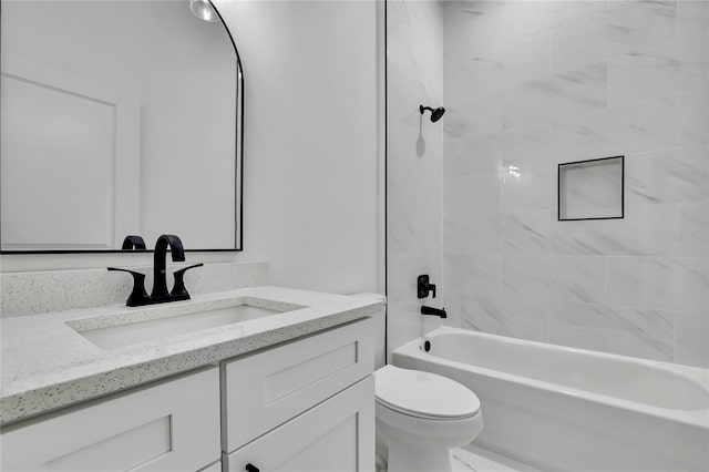 bathroom with washtub / shower combination, toilet, and vanity
