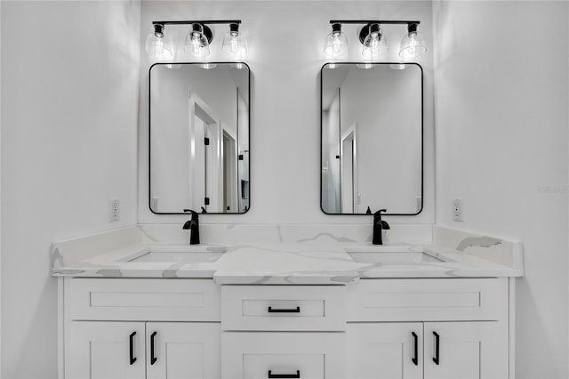 full bath featuring double vanity and a sink