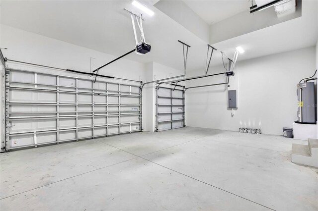 garage featuring electric panel, a garage door opener, and electric water heater