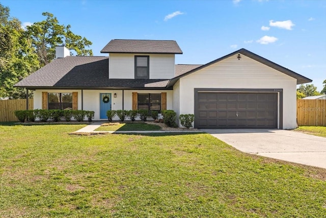 traditional-style house with roof with shingles, fence, a front lawn, an attached garage, and driveway