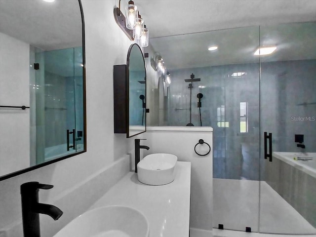 bathroom with a sink and a stall shower