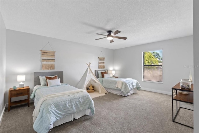carpeted bedroom with a textured ceiling, baseboards, and ceiling fan