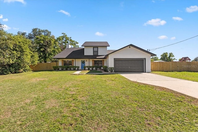 view of front of house featuring a chimney, driveway, a front lawn, a garage, and fence
