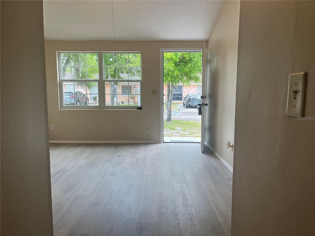 8804 Briar Hollow Ct, Tampa, FL 33634 - interior space with baseboards, a textured wall, and wood finished floors