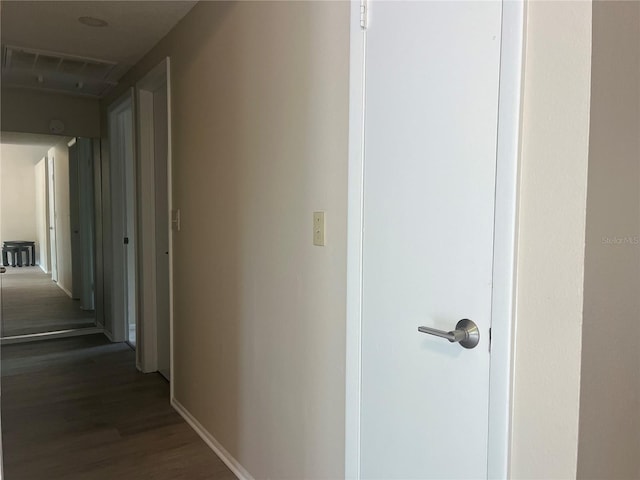 8804 Briar Hollow Ct, Tampa, FL 33634 - hall with visible vents, baseboards, and wood finished floors