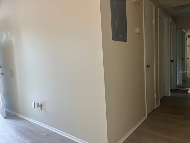 8804 Briar Hollow Ct, Tampa, FL 33634 - hallway featuring baseboards, wood finished floors, and electric panel