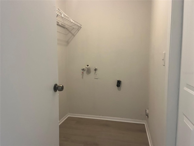 8804 Briar Hollow Ct, Tampa, FL 33634 - laundry area featuring laundry area, wood finished floors, baseboards, electric dryer hookup, and washer hookup