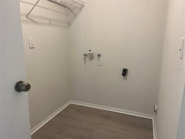 8804 Briar Hollow Ct, Tampa, FL 33634 - clothes washing area with dark wood-style flooring, laundry area, and baseboards