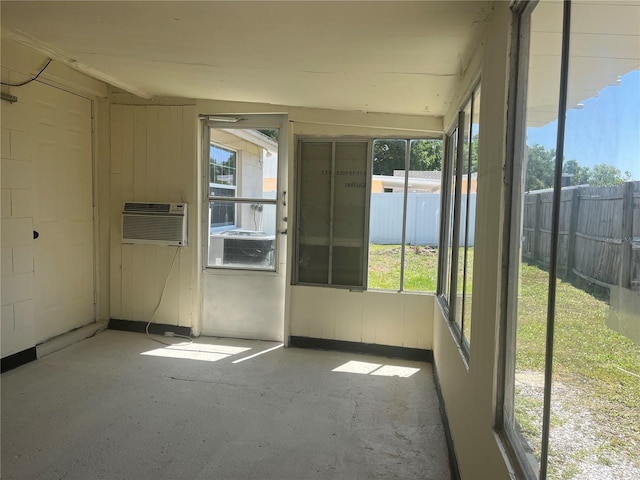 8804 Briar Hollow Ct, Tampa, FL 33634 - unfurnished sunroom featuring a wall unit AC and a wealth of natural light