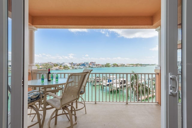 balcony featuring a water view