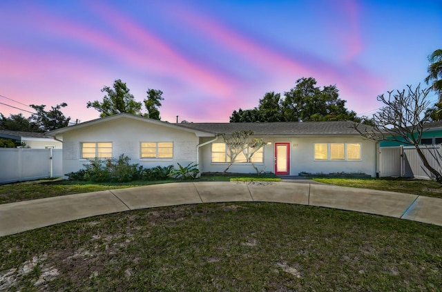 827 Virginia St, Dunedin, FL 34698 - ranch-style house with a gate and stucco siding