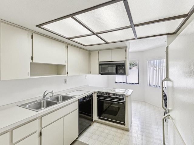 456 Lakeview Dr Unit 5, Palm Harbor, FL 34683 - kitchen with black appliances, a sink, light countertops, light floors, and open shelves