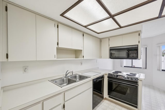 456 Lakeview Dr Unit 5, Palm Harbor, FL 34683 - kitchen with black appliances, a sink, light flooring, light countertops, and open shelves