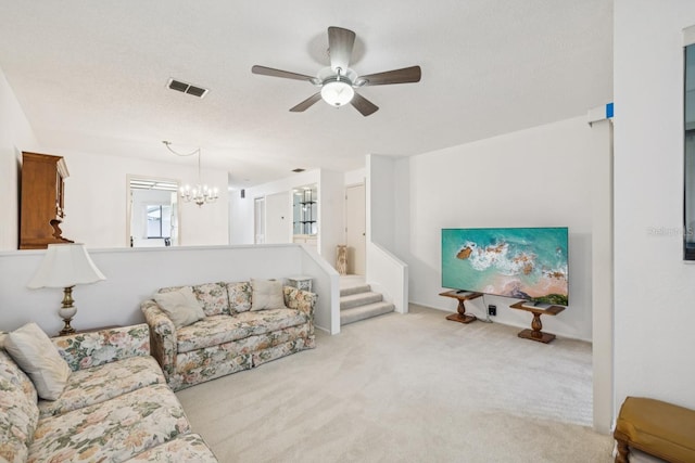 456 Lakeview Dr Unit 5, Palm Harbor, FL 34683 - living room with a chandelier, ceiling fan, and carpet flooring
