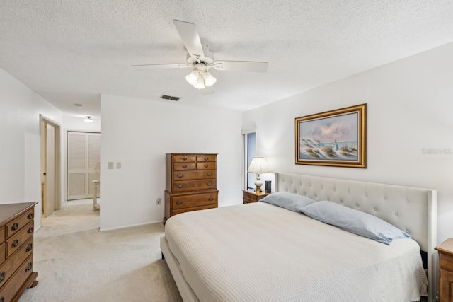 456 Lakeview Dr Unit 5, Palm Harbor, FL 34683 - bedroom with light colored carpet, ceiling fan, and a textured ceiling