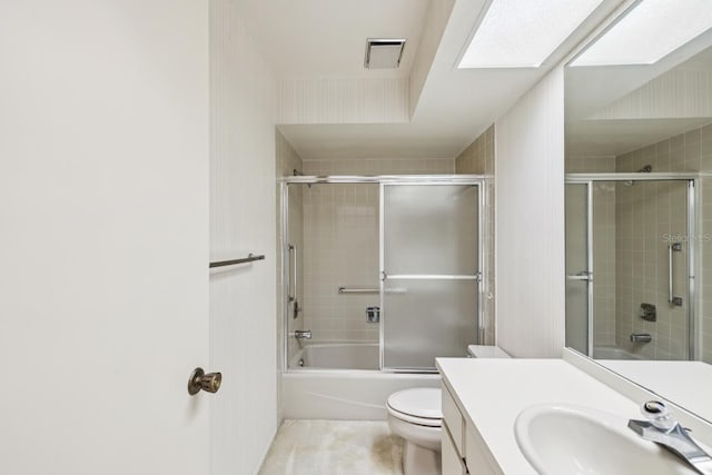 456 Lakeview Dr Unit 5, Palm Harbor, FL 34683 - bathroom with vanity, toilet, and combined bath / shower with glass door