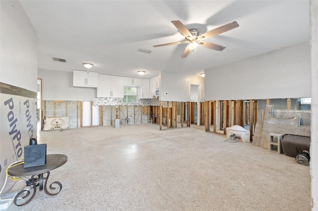 spare room featuring ceiling fan and visible vents
