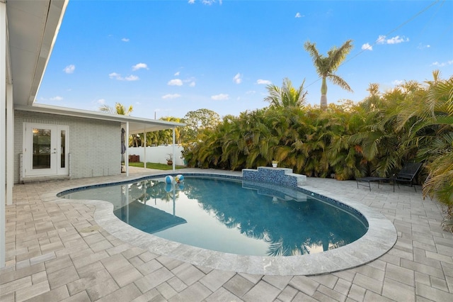 view of swimming pool with fence, a patio area, and a fenced in pool