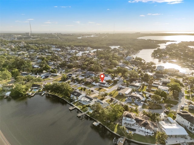 drone / aerial view with a water view and a residential view