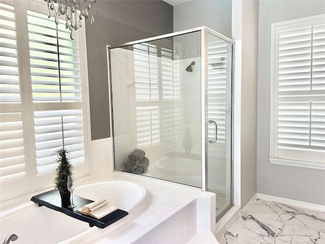 2332 Dekan Ln, Land O Lakes, FL 34639 - bathroom featuring a shower stall, a bath, a healthy amount of sunlight, and marble finish floor