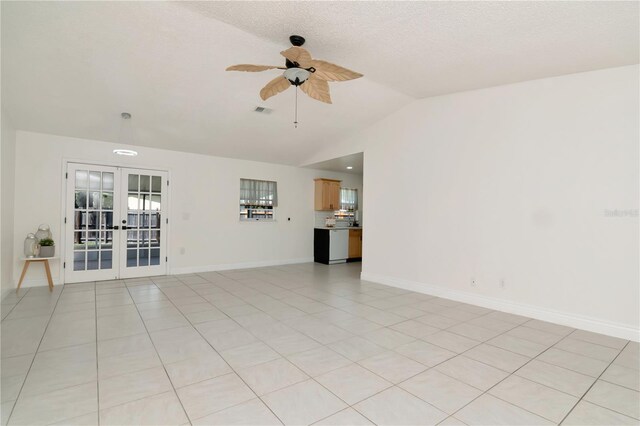 10705 Knollsway Ct, Tampa, FL 33625 - empty room featuring light tile patterned floors, a ceiling fan, visible vents, lofted ceiling, and french doors
