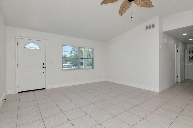 10705 Knollsway Ct, Tampa, FL 33625 - entrance foyer with visible vents, baseboards, light tile patterned floors, a ceiling fan, and vaulted ceiling