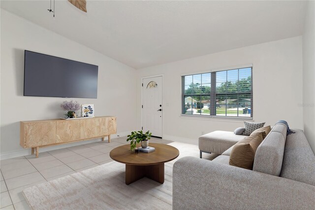 10705 Knollsway Ct, Tampa, FL 33625 - living room featuring light tile patterned floors, baseboards, and lofted ceiling