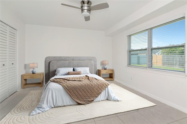 10705 Knollsway Ct, Tampa, FL 33625 - bedroom featuring tile patterned floors, ceiling fan, and baseboards