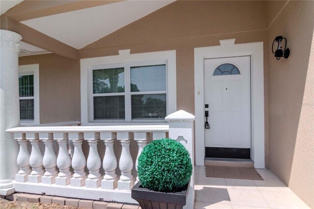 10705 Knollsway Ct, Tampa, FL 33625 - view of exterior entry featuring stucco siding