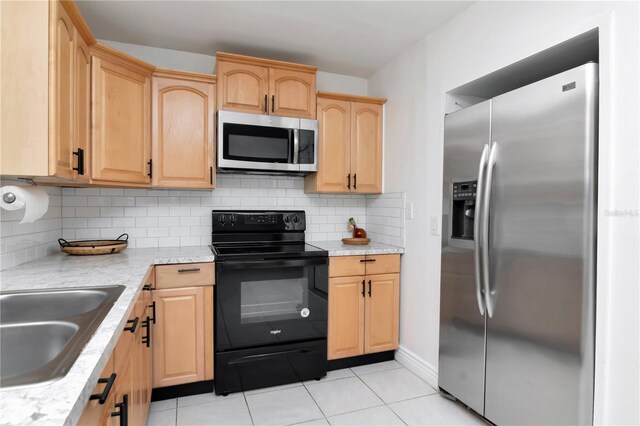 10705 Knollsway Ct, Tampa, FL 33625 - kitchen featuring a sink, light countertops, light brown cabinetry, stainless steel appliances, and backsplash