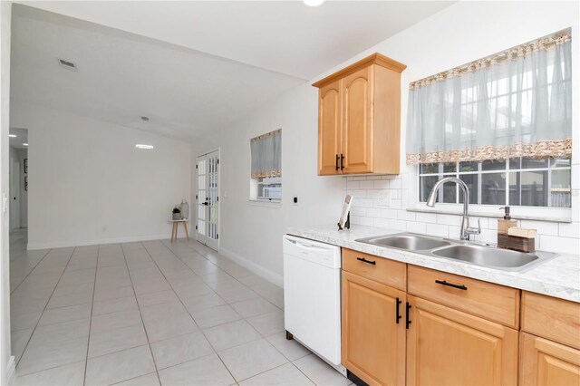 10705 Knollsway Ct, Tampa, FL 33625 - kitchen featuring light brown cabinetry, a sink, light countertops, white dishwasher, and decorative backsplash