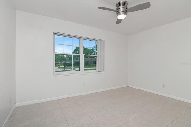 10705 Knollsway Ct, Tampa, FL 33625 - spare room with ceiling fan and baseboards