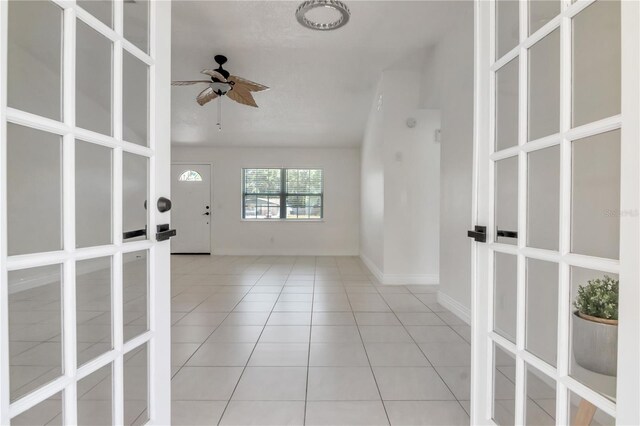 10705 Knollsway Ct, Tampa, FL 33625 - spare room with ceiling fan, baseboards, and light tile patterned flooring
