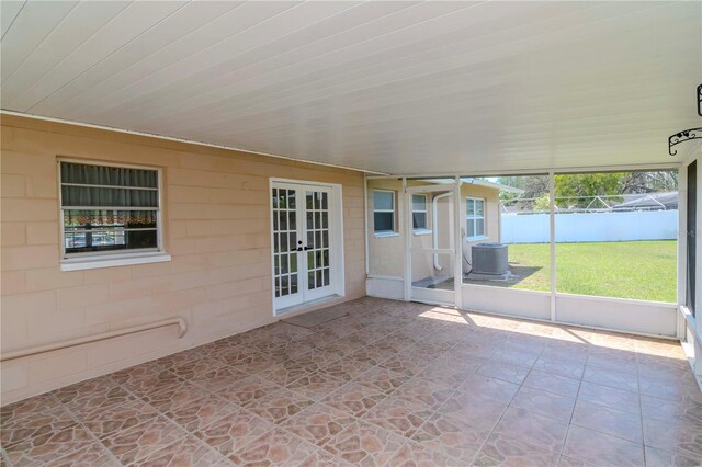 10705 Knollsway Ct, Tampa, FL 33625 - unfurnished sunroom featuring french doors