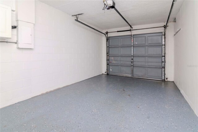 10705 Knollsway Ct, Tampa, FL 33625 - garage featuring concrete block wall