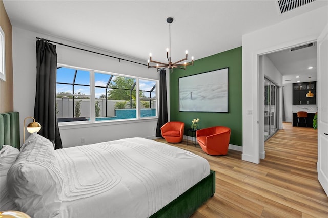 8720 Drummer Plank Dr, Wesley Chapel, FL 33545 - bedroom featuring an inviting chandelier, light wood-style floors, radiator, baseboards, and visible vents