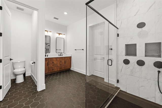 8720 Drummer Plank Dr, Wesley Chapel, FL 33545 - bathroom featuring double vanity, visible vents, a shower stall, a sink, and toilet