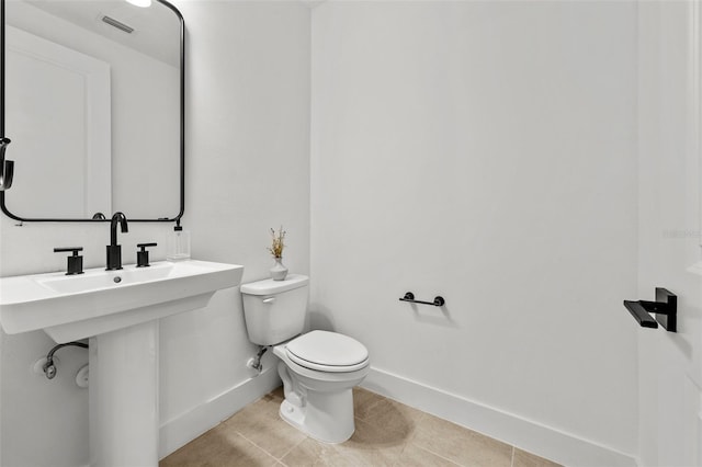 8720 Drummer Plank Dr, Wesley Chapel, FL 33545 - half bathroom with baseboards, tile patterned flooring, visible vents, and toilet
