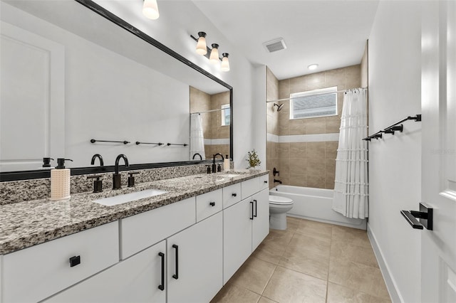 8720 Drummer Plank Dr, Wesley Chapel, FL 33545 - bathroom featuring double vanity, tile patterned floors, visible vents, and a sink
