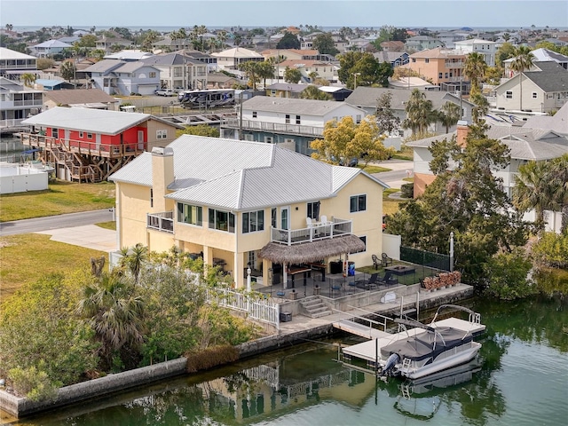 aerial perspective of suburban area featuring a nearby body of water