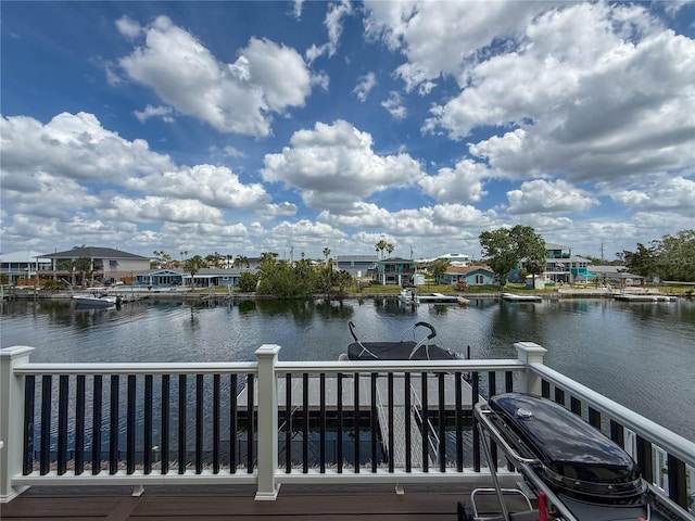 dock featuring a water view and a residential view