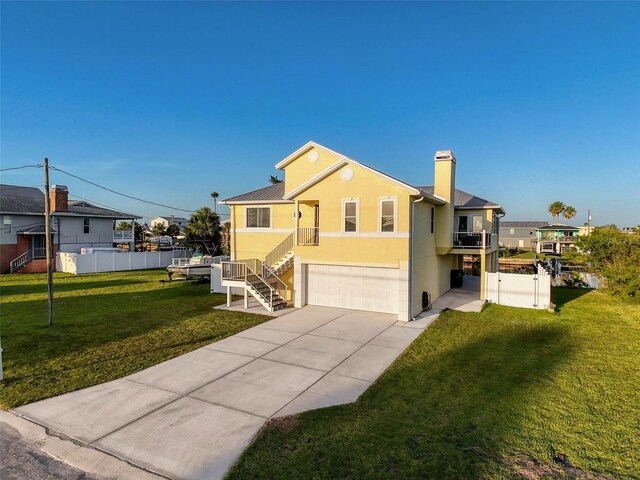 4116 Diaz Ct, Hernando Beach, FL 34607 - view of front of property with a garage, concrete driveway, stucco siding, a chimney, and stairs