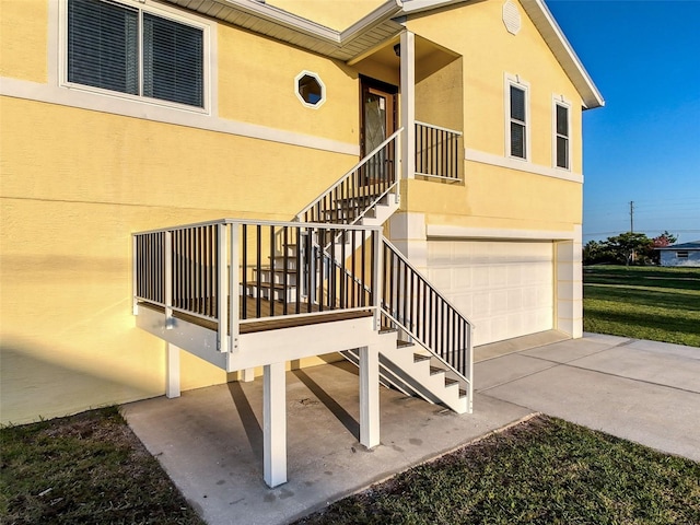 4116 Diaz Ct, Hernando Beach, FL 34607 - doorway to property featuring driveway, a garage, and stucco siding